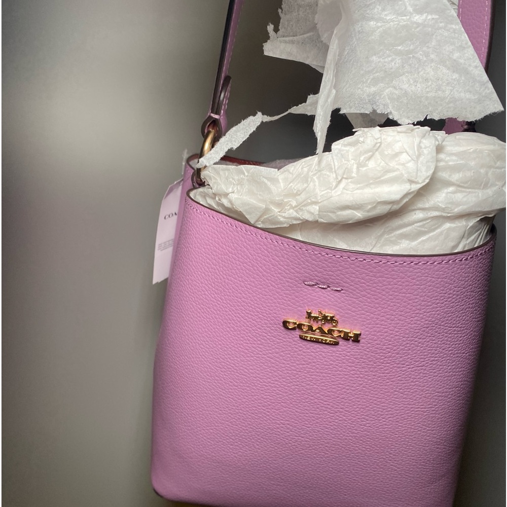 Really cute coach bucket bag it has a divider in the middle